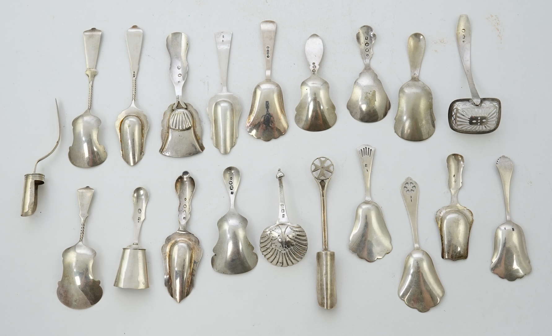 A collection of seventeen mainly 19th century Dutch white metal caddy spoons